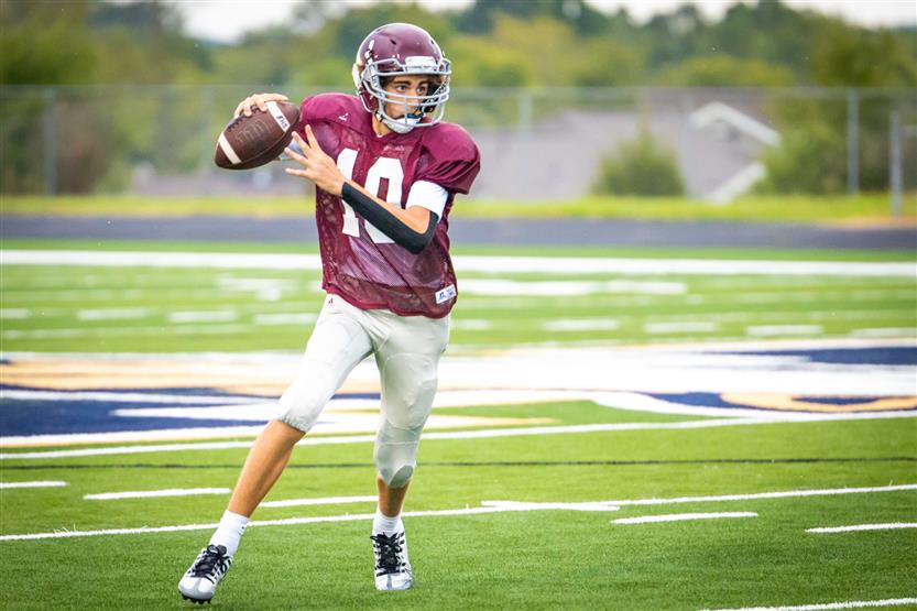 A football player prepares to throw the ball
